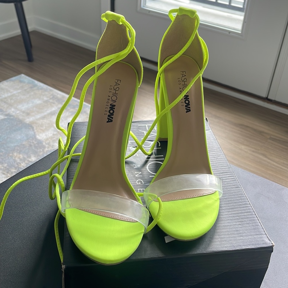 Lightly worn neon lace-up heel.